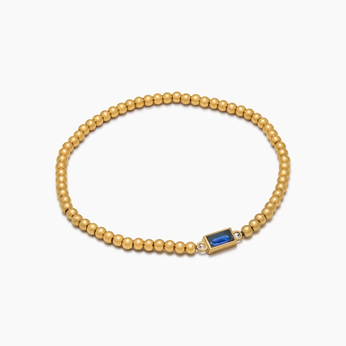 Gold beaded bracelet with a birthstone