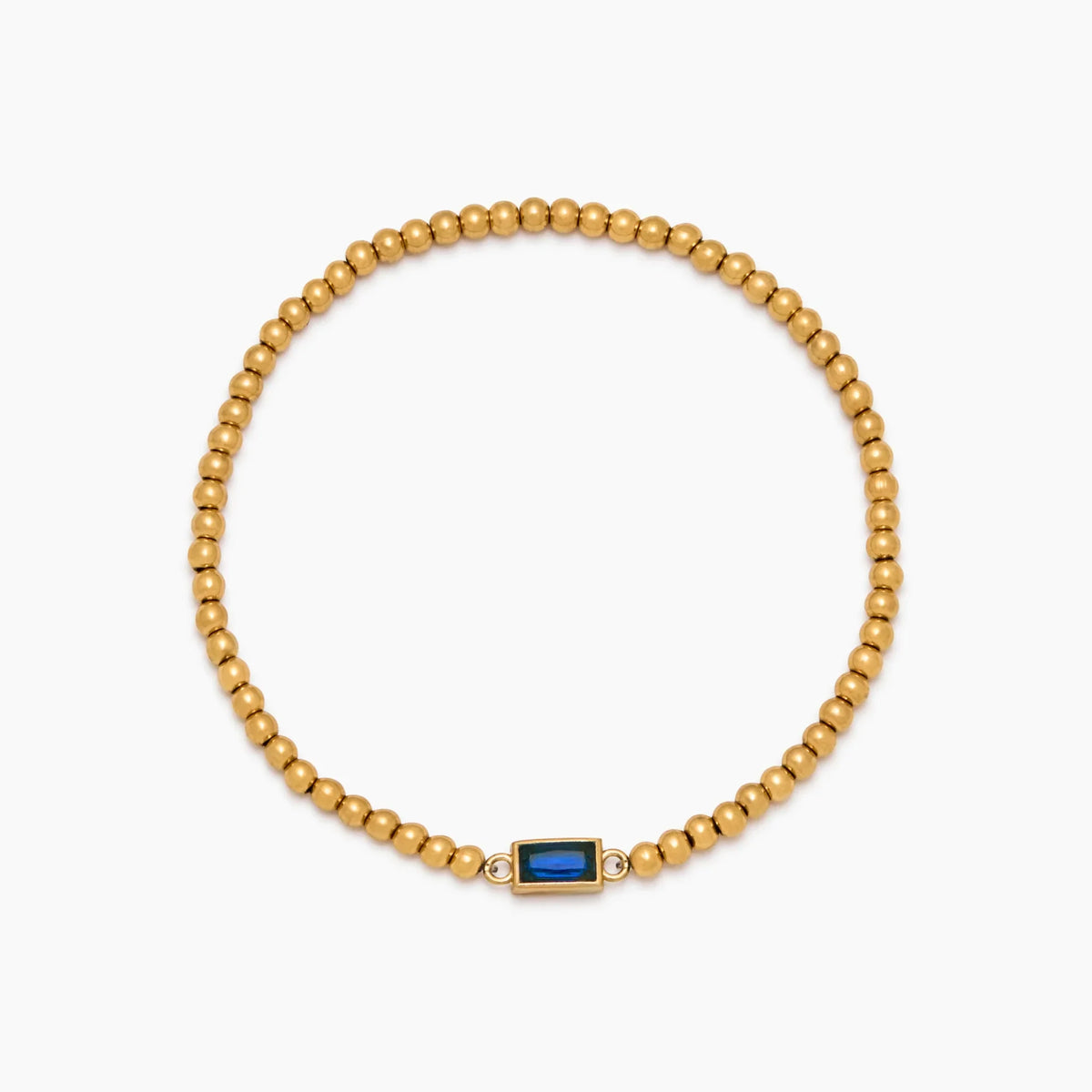 Gold beaded bracelet with a birthstone